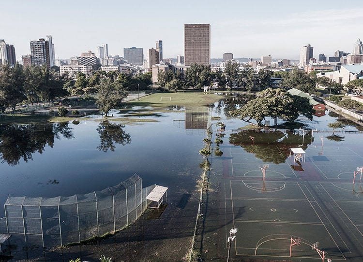 This aerial view shows sports fields under water on April 15 in Durban, a seaport in South Africa’s eastern KwaZulu-Natal province.