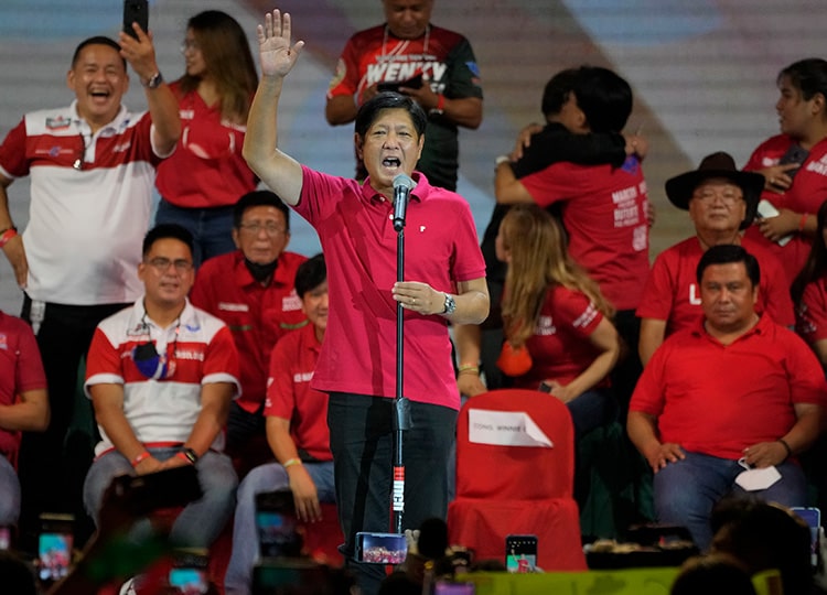 Presidential hopeful and former Philippine Sen. Ferdinand “Bongbong” Marcos Jr., the son of the late dictator, talks to a crowd during a campaign rally in Quezon City on April 13.