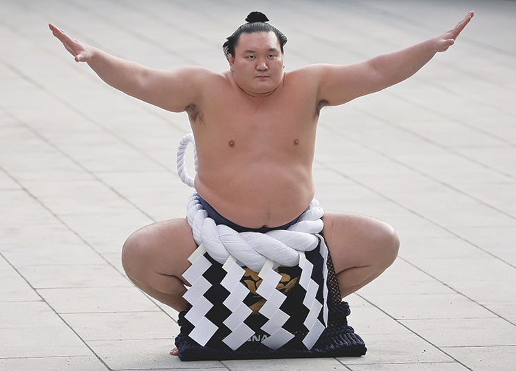 Hakuho performs a New Year’s ring-entering rite at the annual celebration for the new year at Meiji Shrine in Tokyo in January 2016.