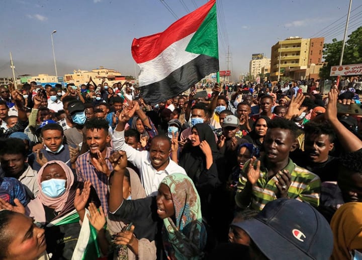 Sudan’s military takes power in coup, arrests prime minister as crowds protest