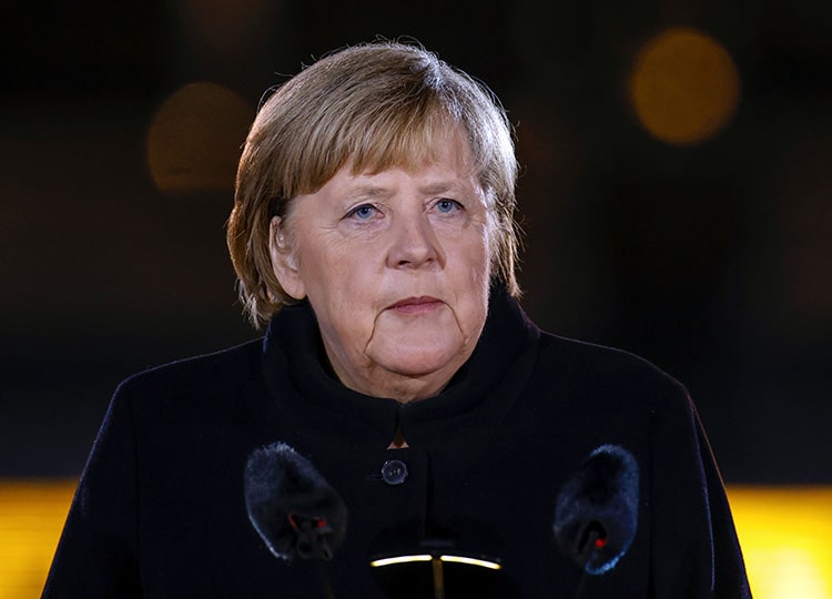 German Chancellor Angela Merkel makes a speech at the Defense Ministry during the Grand Tattoo (Grosser Zapfenstreich), a ceremonial send-off for her, in Berlin on Dec. 2.
