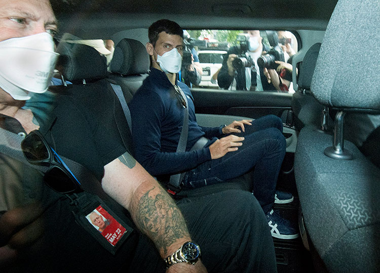 Novak Djokovic is seen in a car as he leaves a government detention facility before attending a court hearing at his lawyer’s office in Melbourne, Australia, on Jan. 16.
