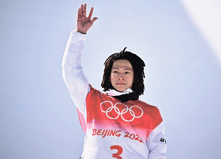 Ayumu Hirano poses on the podium after the snowboard men’s halfpipe final run during the 2022 Beijing Winter Olympic Games at Genting Snow Park in Zhangjia-kou on Feb. 11.