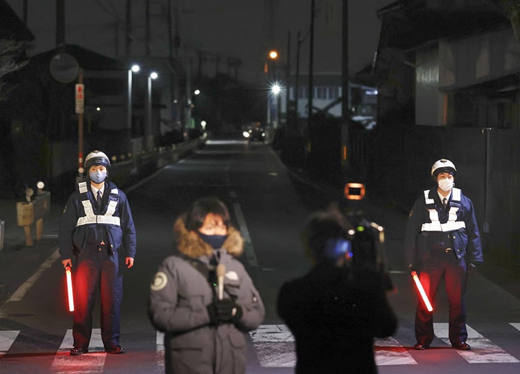 Police secure the area near a house where an armed man took a hostage in Fujimino, Saitama Prefecture, on Jan. 27.