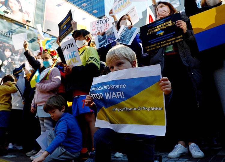 A Ukrainian boy holds a banner during a rally against Russia’s invasion of Ukraine, in Tokyo on Feb. 26.
