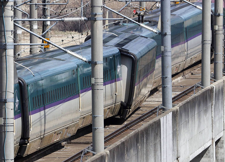 Derailed Tohoku Shinkansen train cars in Shiroishi, Miyagi Prefecture, on March 17.