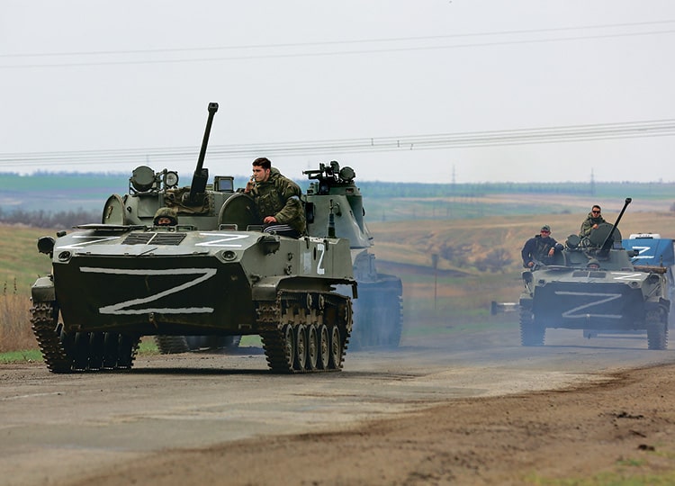 Russian military vehicles move on a highway in an area controlled by Russian-backed separatist forces near Mariupol, Ukraine, on April 18.