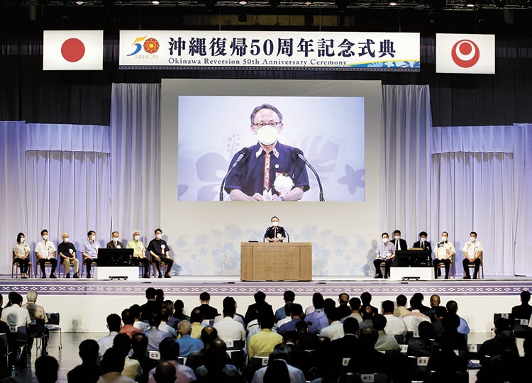 Okinawa Gov. Denny Tamaki speaks at a commemoration ceremony held in Ginowan, Okinawa Prefecture, on May 15.